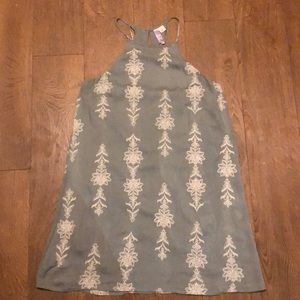 Green sheath dress with white embroidery